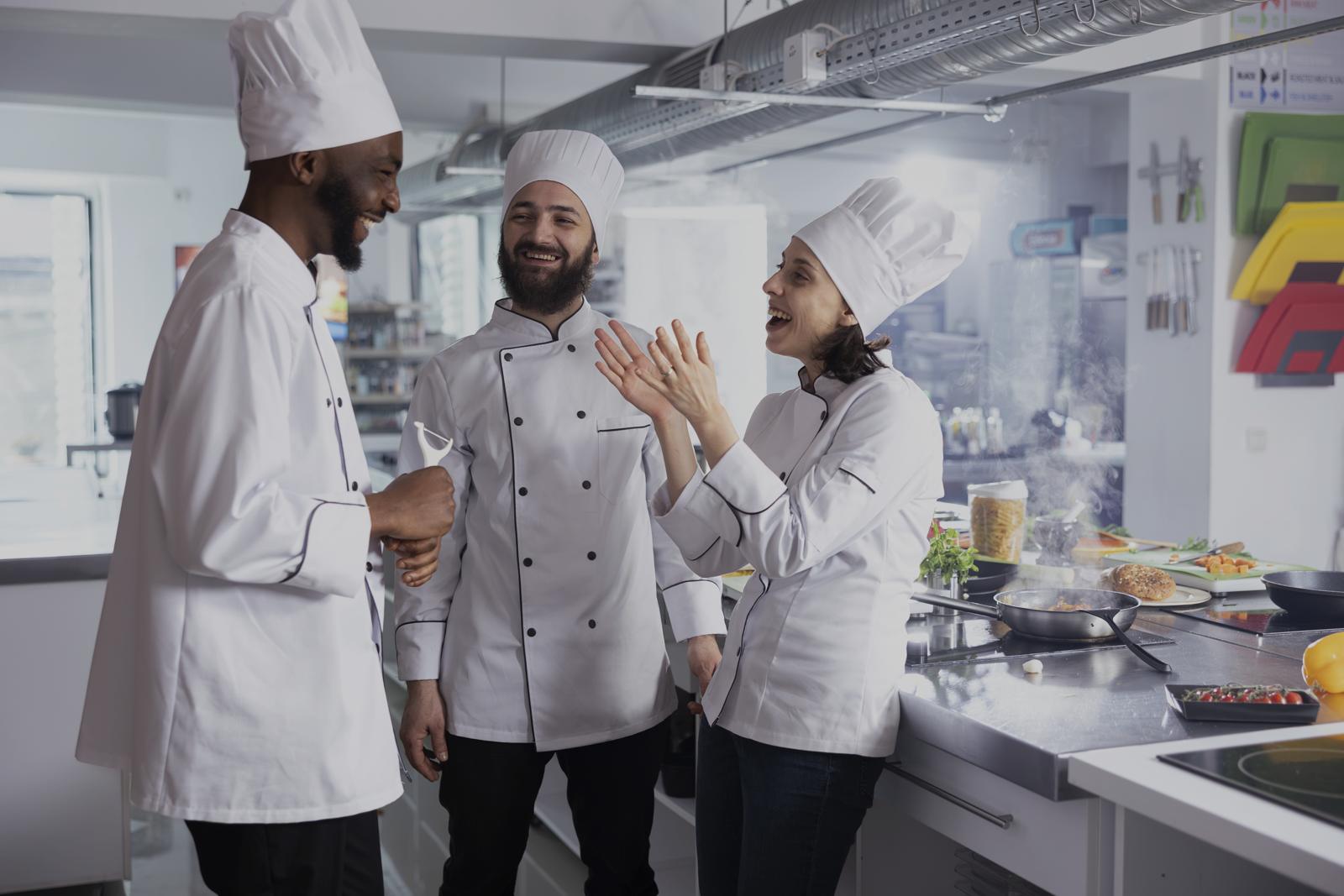 Chefs working in a busy restaurant kitchen